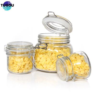 China Steamable Wholesales Factory Price Glass Jar With Metal Clip/Glass Storage Jar Bottle With Flip Top lid for sale