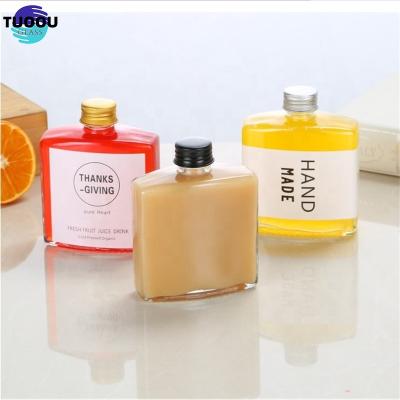 China High Quality Hot sale 200ml 500ml Clear Cold Brew Coffee Juice With Aluminium Cap 250ml 50ml Flat Shoulder 100ml Glass Bottle For Wine for sale