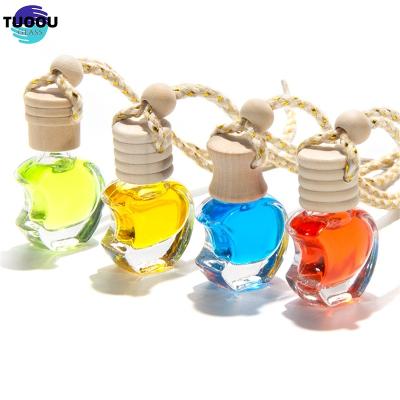 China Cosmetic Car empty cap mounted perfume pendant odor removal fragrance essential oil subpackage glass bottle car accessories for sale