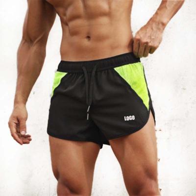 China Custom Anti-Wrinkle Men 2 In 1 Gym Training Shorts Quick Dry Sport Running Shorts Zipper Pocket Pants Mens Shorts With Patchwork for sale