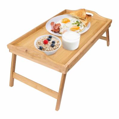 China Sustainable Bamboo Foldable Breakfast Table Bed Tray Table With Legs Bamboo Serving Trays With Handles for sale