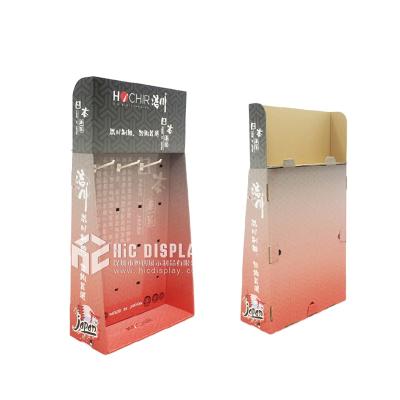 China Gray Cardboard Corrugated Cardboard Cosmetic Product Partner Display With Peg Hooks for sale