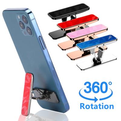 China Adjustable Folding Mini Metal Phone Holder Aluminum Alloy Desktop Stand 360 Rotating Universal Mobile Phone Bracket Foldable for sale