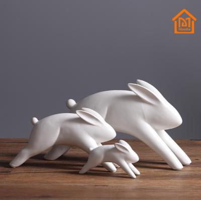 China Europe Custom Design Pure White Porcelain Jumping Rabbit Figurines for sale