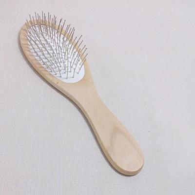 China Pinos de metal de bambu da escova de cabelo da massagem do punho com o coxim de ar branco à venda