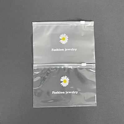 China Daisy Transparent Frosted Plastic Small Pencil Jewelry Cloth Storage PVC Bag Food Zipper Small Custom Apparel Pouch Slider for sale