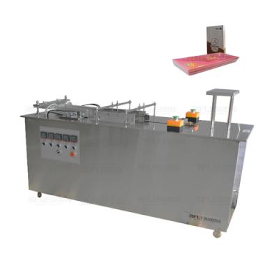 China Semi-automatic Food Cosmetics Box Cellophane Wrapping Machine for sale