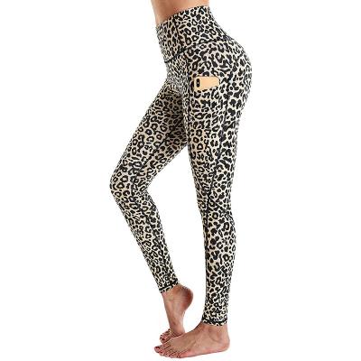 China Breathable Womens Yoga Pants With Pockets High Waist Workout Gaiters Running Trousers for sale