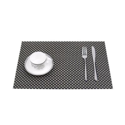 China New minimalist European and American hotel style PVC western table mat, European style heat insulation place mat, woven thickened table mat for sale