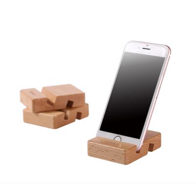 China PORTABLE Cell Phone Stand Accessories Lazy Square Low Square Desktop Stand Wooden Phone Stand for sale