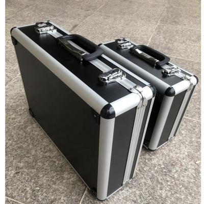 China Waterproof shockproof dustproof lockable black metal aluminum suitcase with handle and customizable foam for sale