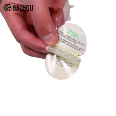 China Anti Counterfeit Round Skin And Reveal Sticker Laminated Leaflet Labels Plastic Skin Off Stickers for sale