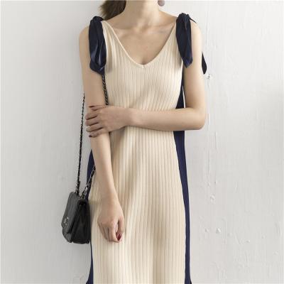 China Anti-Static Women Customize Contrast Slit Sleeveless Knitted Mid Length V-Neck White And Black Dress for sale