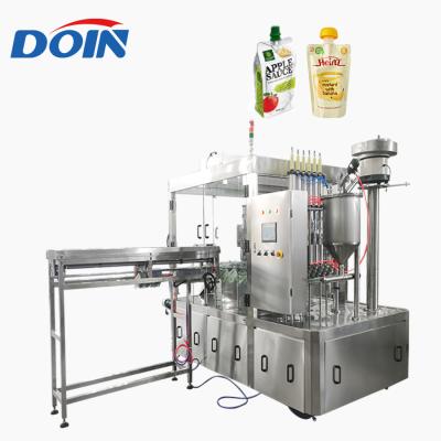 Cina Food Doin supply yogurt spout pouch screw packing machine factory/soy milk doypack spout pouch filling capping machine in vendita