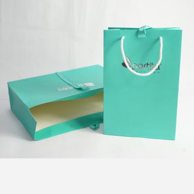 China Recyclable Branded Custom Coated Hot Stamping Paper Shopping Bags With Ribbon Handles for sale