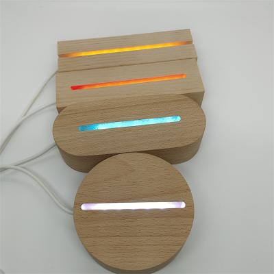 China Modern Night Light Trophy Bluetooth 3d Socket Base Wooden Night Light USB Round Led Light Wooden Base for sale