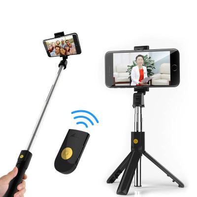 China Portable Retractable Wireless Selfie Stick Smartphone Selfie Stick Universal 360 Rotation with Invisible Tripod Holder for sale