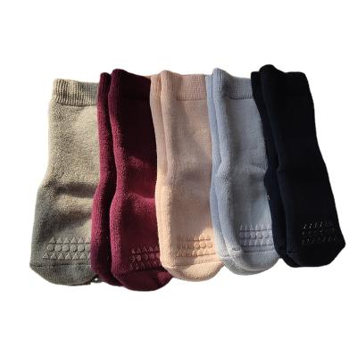 China Breathable Denmark Spain Kids Dot Glue Floor Socks Double-Sided Autumn Winter Thickened Baby Tube Socks for sale