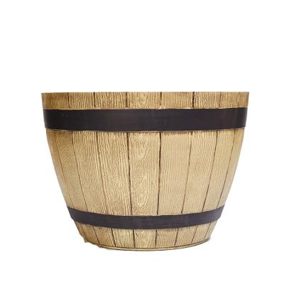 China Decorative Wooden Barrel Durable Plastic Garden Whiskey Spray Paint Effect Flower Plant Pot For Outdoor for sale