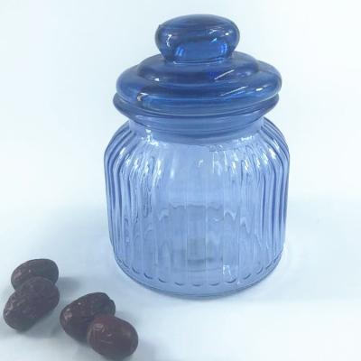 China Sustainable Round Glass Storage Jars For Food Customized Color Glass Flower Vase for sale