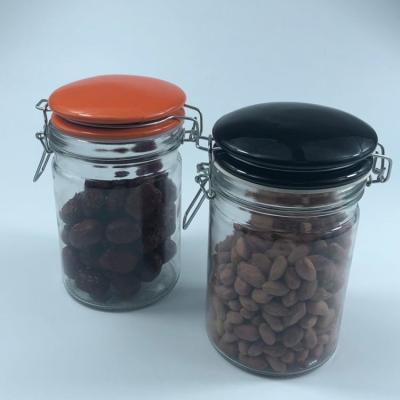 China Sustainable Glass Bottle Manufactures Small Storage Glass Jar For Food With Ceramic Lid for sale