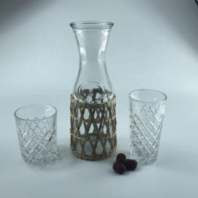 China Sustainable Sale 1L Clear Juice Hot Milk Beverage Glass Jars Bottles With Straw Braided Item for sale