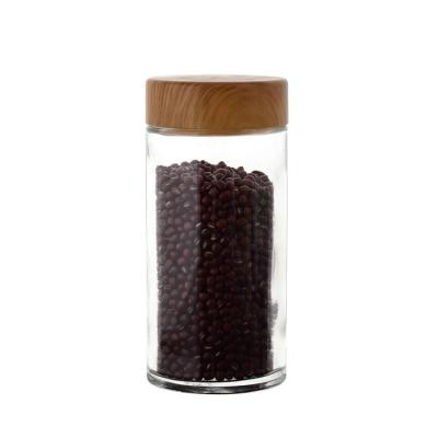 China Custom Empty Bamboo Glass Food Storage 500ml Glass Jar Cork Jar Coffee Tea Storage Wooden Jar for sale