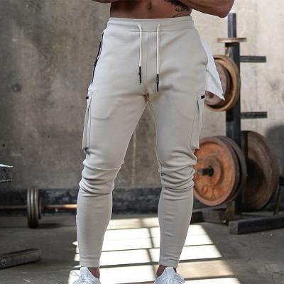 China Anti-pilling New Design Sweatpants Printed Elastic Waist Pockets Casual Gym Training Cargo Pants For Men for sale