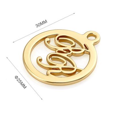 China Durable Customized Circle Shape With Buckle Hang Metal Logo For Bags, Design Gold Metal Tag For Handbags for sale