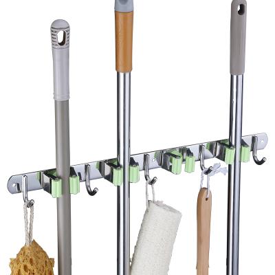 China Customized Viable Heavy Duty 201Stainless Steel Broom Holder 4 Racks 5 Hangs Multifunctional Wall Mounted Broom Storage Tools Organizer for sale