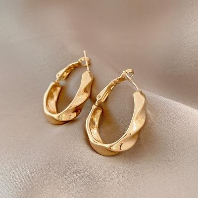 China Trendy Fashion Influencing Gold Twist Circle Earrings Women's European And American Metal Earrings 2021 The New for sale