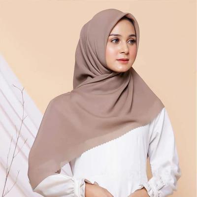 China Mid 2021 New Arrive Wholesale Cheap Scarf 110*110cm Square Solid Color Laser Cut Muslim Women Cotton Hijab for sale