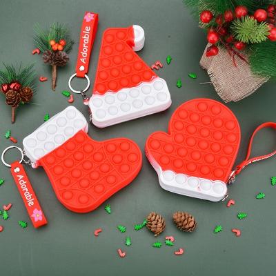 China Non-Toxic Christmas Style Silicone Push Button Bubble Bag Sock Glove Hat Shape Coin Pouch for Kids Coin Purse Filter Frame with Key Ring for sale