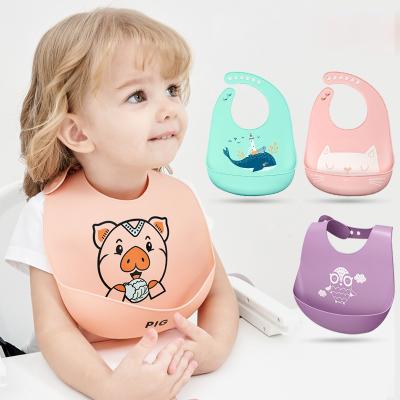 China BPA Free Newborn Infant Toddlers Comfortable Gently Wipe Clean Unisex Silicone Baby Bibs with Food Catcher Pocket for sale