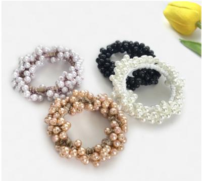 China Cabelo fashion accessory KL and Femai elegant beautiful hair ties hand beaded pearl hair rope elasticity ladies headband the top for sale