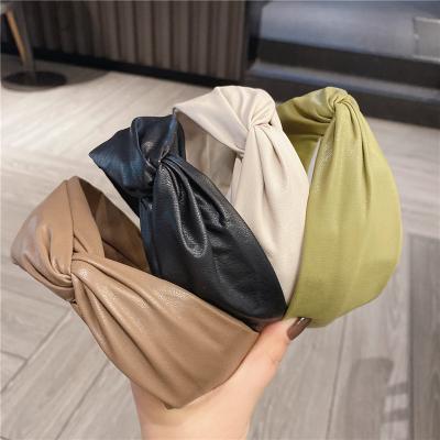 China Latest Designs Accessories Fashion Decorative Solid Colors Handmade Wide Twist Hair Circle Headbands For Women PU Leather Headband for sale