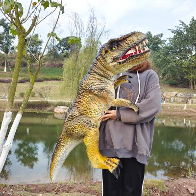 China Muñeco de dinosaurio de mano realista Inmune al sol Muñeco de mano de tiranosaurio rex en venta