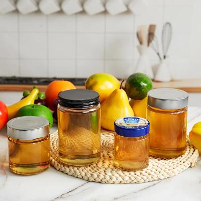 China Freshness Preservation Clear Food Container Round Tall Honey Jars 500g Glass For Honey Packaging With Screw Lid for sale