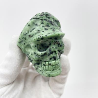 China China high quality natural hand carved Crystal Red green treasure skulls fengshui stone skull healing for decoration and gifts for sale