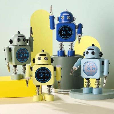 China LUMINOVA Robot Shape Creative Cute Bedroom Decor Smart Life Mini Metal Alarm Clock Cartoon Gifts For Kids for sale