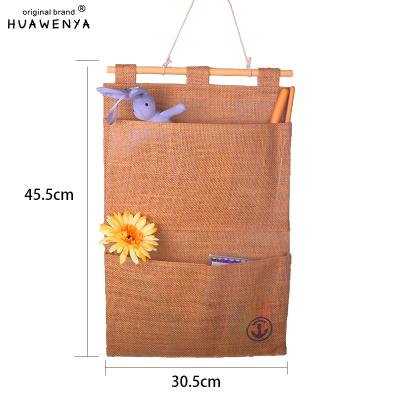 China Sustainable House Modeling Wall Storage Bag 6 Pockets Flamingo Pattern Storage Bag Multifunctional Folding Various Hanging Bag for sale