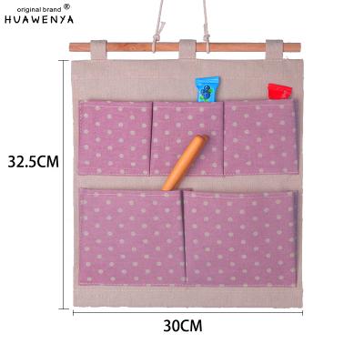 China 2022 Hot Style Viable Oxford Waterproof Hanging Wall Mounted Wardrobe Hang Bag Wall Pouch Cosmetic Storage Bag 3 Pockets Toys Organizer for sale