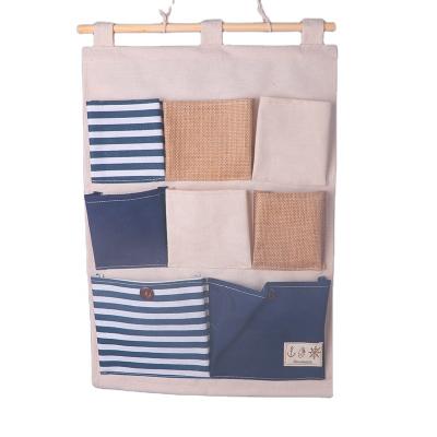 China Five Pockets Bag Bedroom Cloth Art Cotton And Linen Wall Viable Three-Dimensional Hanging Door Behind Wall Hanging Bag for sale