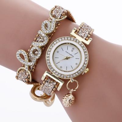 China New LOVE Ornament Buckled Bracelet Watch Small Ball Clasp Ladies Diamond-Inlaid Ladies Quartz Pendant Watch for sale