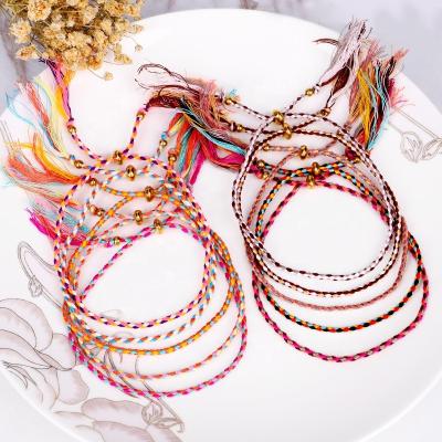 China CLASSIC Adjustable Handmade Bohemian Style Copper Inlay Weave Bead Cotton Colorful Tassel Braided Bracelets for sale