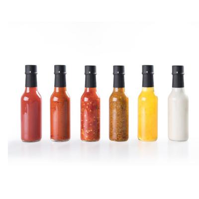 China 5oz Food Grade Heatable Lead Free / 150ml Hot Sauce Glass Bottles With Leak Proof Screw Top for sale