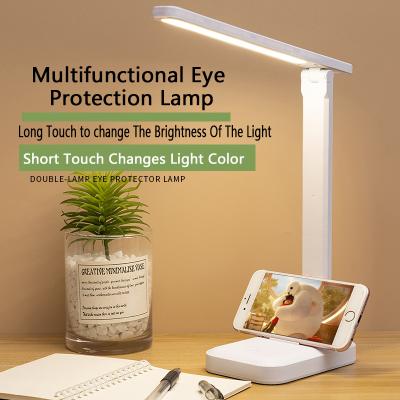 China As Popular Modern Led Rechargeable Table Lamp 3 Color Mobile Phone Stand Usb Rechargeable Reading Light en venta