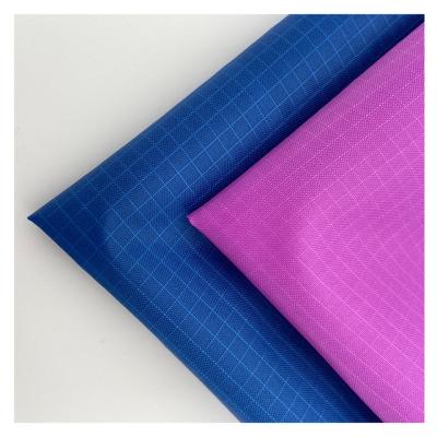 China Waterproof Hot Selling 100% Polyester Taffeta Ribstop Fabric PU Coated Waterproof 210T Fabric for sale