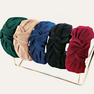 China Fashion Wholesale New Ladies Fashion Hair Circle Wide Edge Fabric Twist Headband Pure Color Tied Headbands for sale