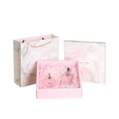 China Recyclable Luxury Cardboard Foldable Magnetic Cosmetic Clothes Boxes Custom Pink Paper Gift Box Packaging With Logo for sale